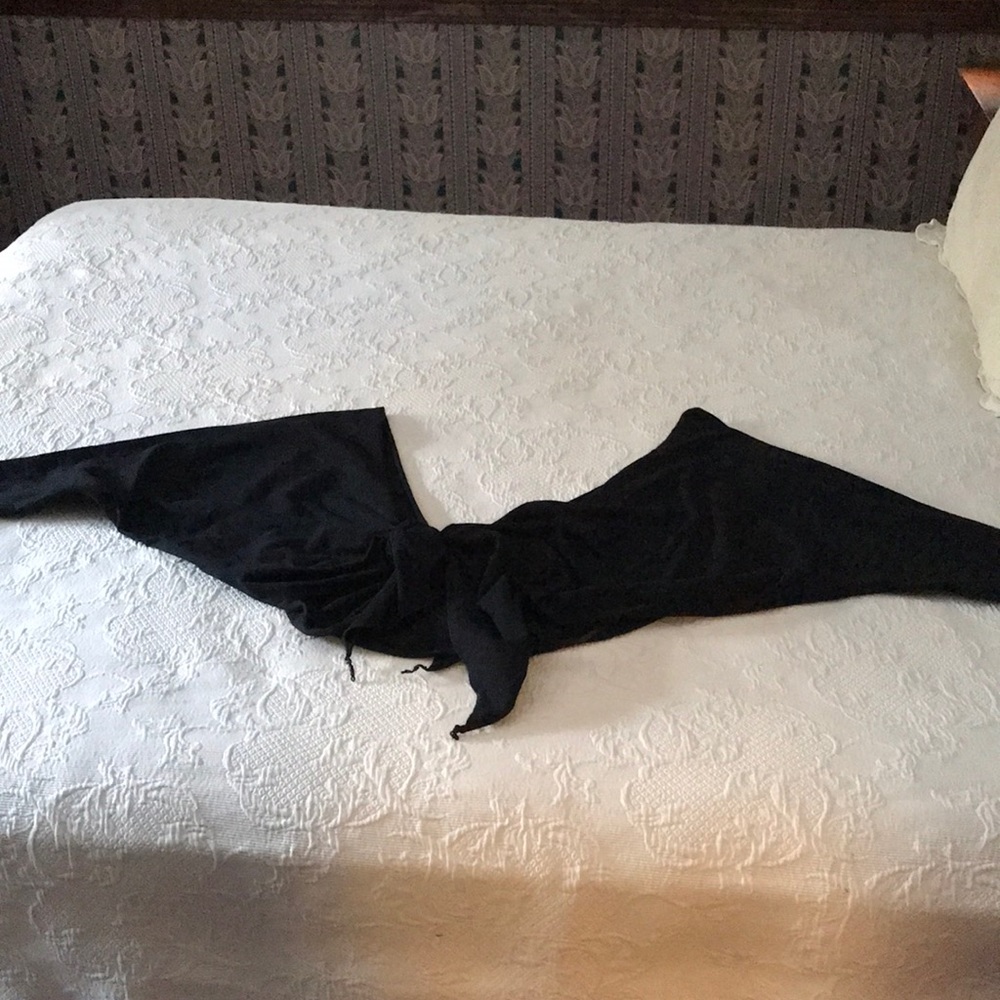 An accessory to wear over a top or dress